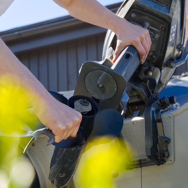 Man,Changing,Propeller,On,Outboard,Motor.,Repairing,Outboard,Motor,For